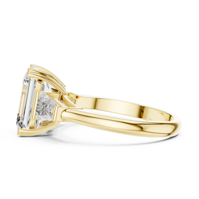 The Clara emerald-cut lab-grown diamond engagement ring with baguette side stones in yellow gold