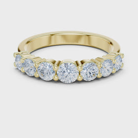 The Ella seven-stone diamond wedding band in yellow gold — rotating view